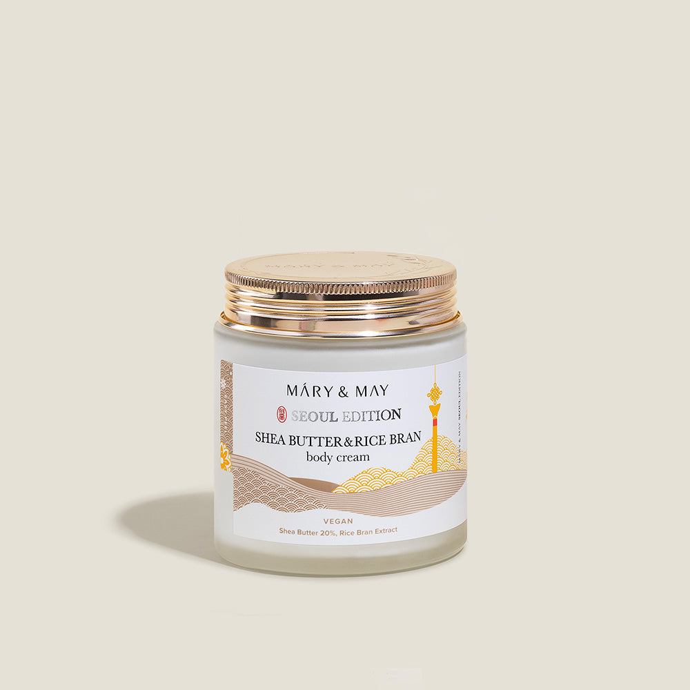 Indulge in the luxurious Mary&May Shea Butter & Rice Bran Body Cream, crafted in South Korea to nourish and elevate your skincare ritual with its exquisite formulation.