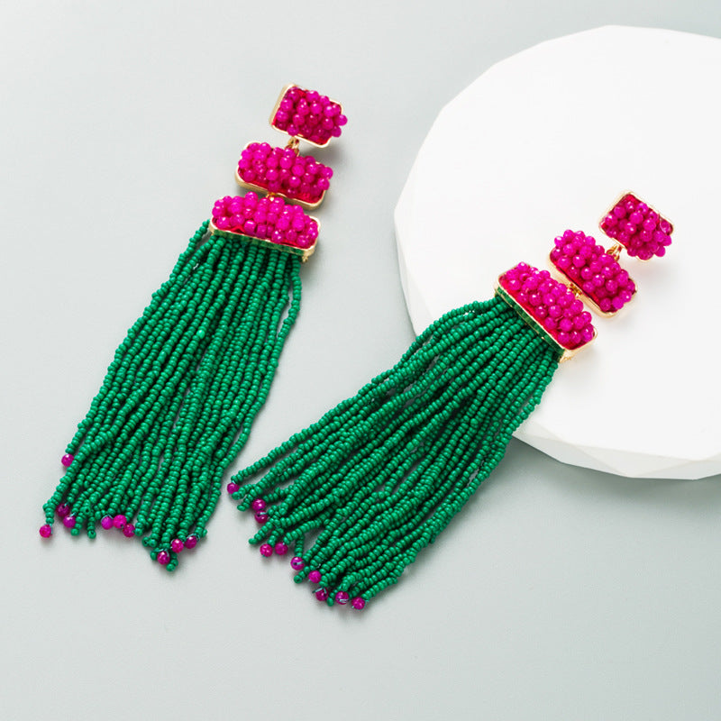 Discover athé's Exquisite Long Bohemian Rice Bead Earrings, handcrafted in South Korea with gold-plated elegance and luxurious rice beads, embodying timeless sophistication.