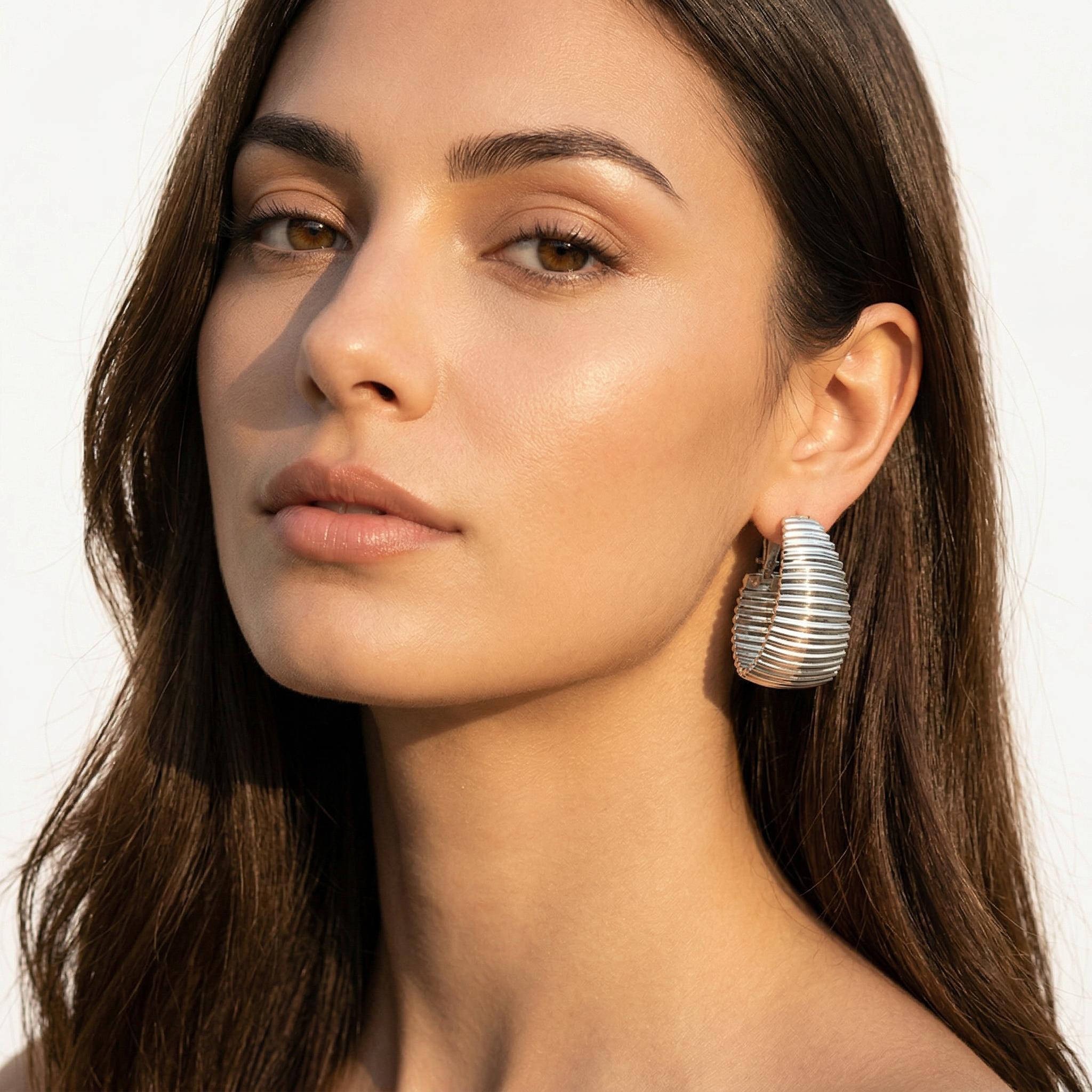 Discover athé's luxurious Chic Punk Metal Stripe C-Shaped Earrings, expertly crafted in South Korea, blending high-quality iron with sophisticated design for timeless elegance.