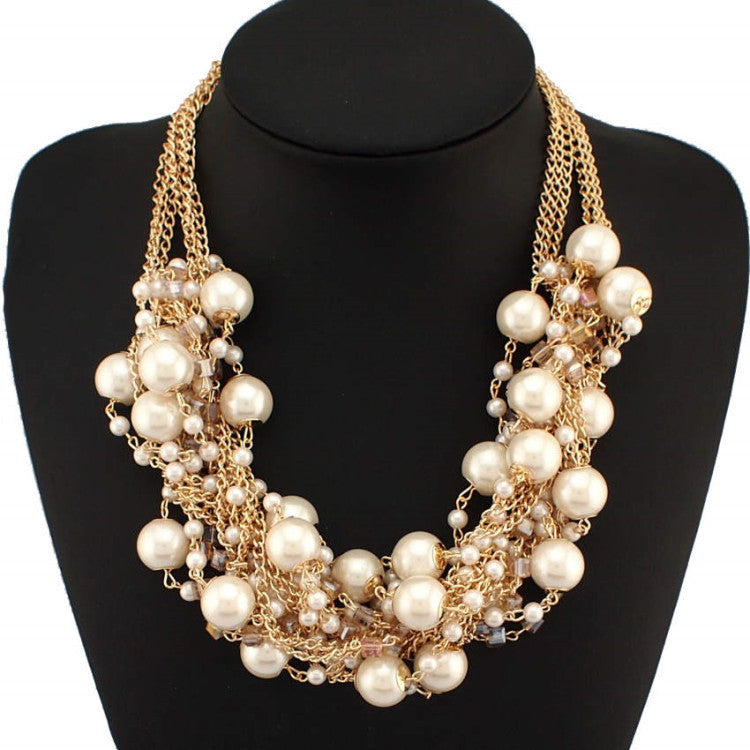 Discover athé's Exquisite Pearl and Rhinestone Statement Necklace, a testament to South Korean craftsmanship that elevates your elegance with luxurious materials and timeless allure.