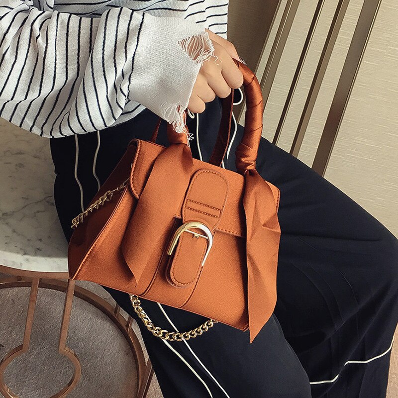 Discover the exquisite athé Velvet Bow-Accent Handbag, crafted in South Korea from sumptuous velvet, embodying elegance and versatility for the discerning connoisseur.