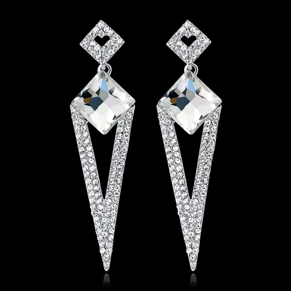 Discover athé's Exquisite Diamond Inlaid Water Drop Long Earrings, handcrafted in South Korea, blending luxury materials and artistry for timeless elegance.