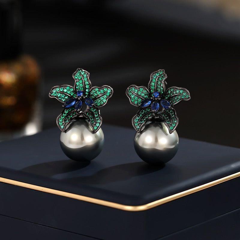 Discover athé's Luxe Gun Black Pearl Lily Earrings, meticulously crafted in South Korea from durable copper and zircon inlay, embodying timeless elegance for every occasion.