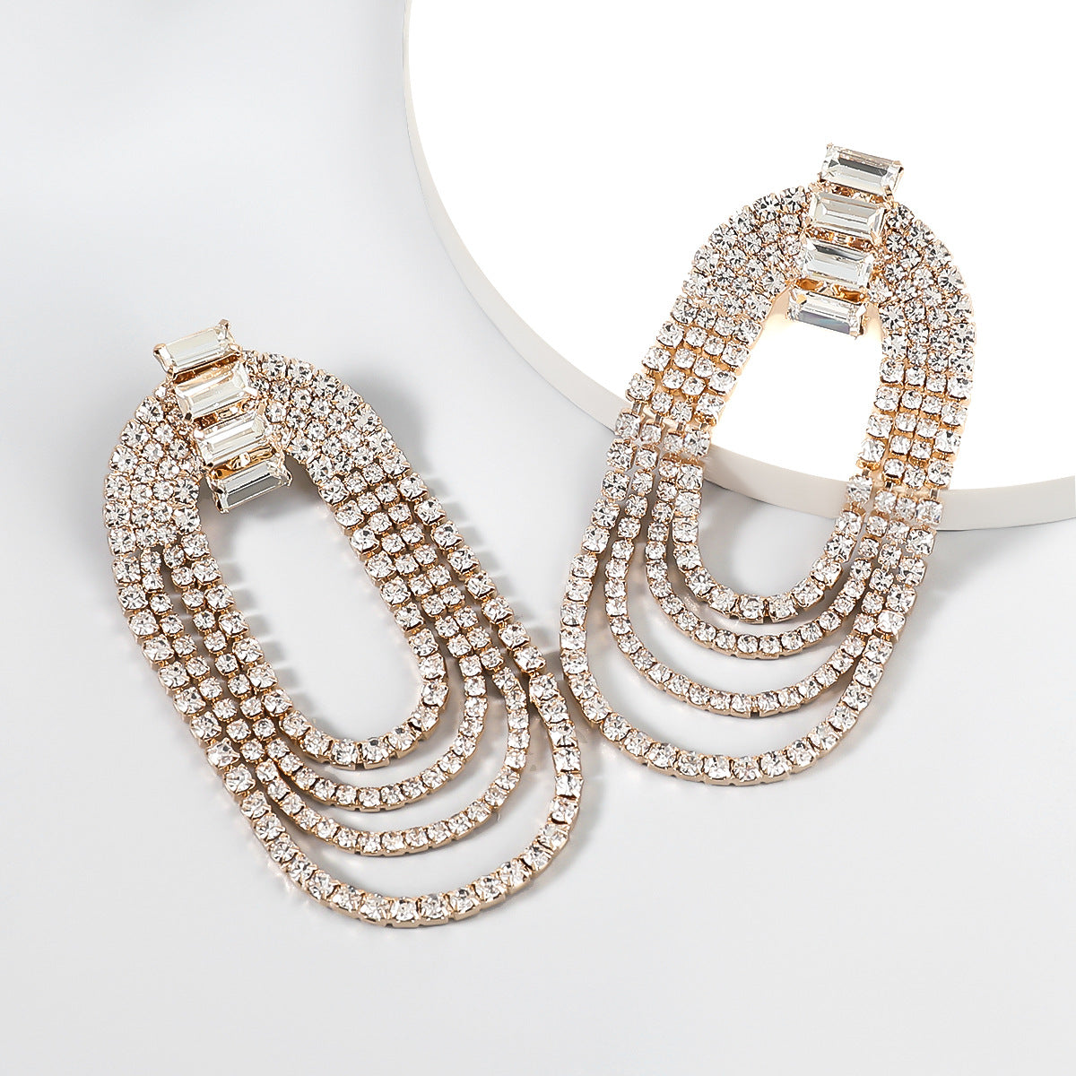 Discover athé's Luxe Alloy & Rhinestone Oval Dinner Earrings, meticulously crafted in South Korea, embodying timeless elegance and sophisticated allure for every occasion.